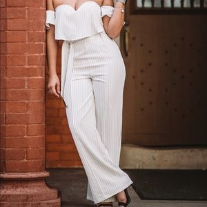 Selfie Leslie matching black stripe pants and off the shoulder cropped top